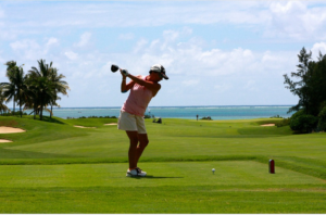 swinging golf club